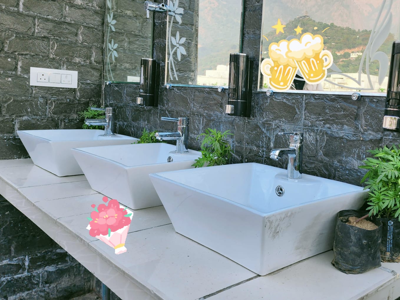 Rooftop washbasin area with hill views